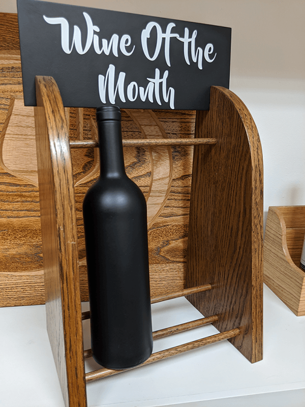 a wine botttle holder with personaised header