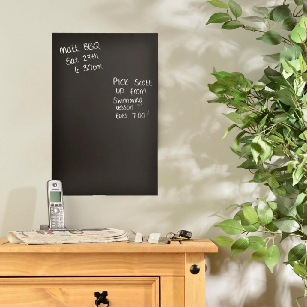 plain chalkboard hung on a wall for family notes and reminders