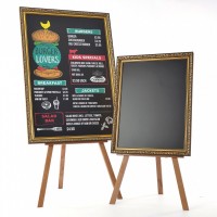 two ornated framed chalkboards on a wooden easel